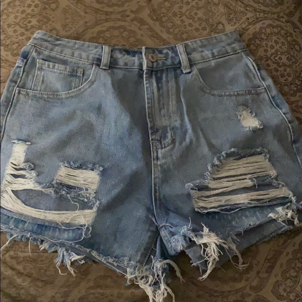 Torn up jean shorts